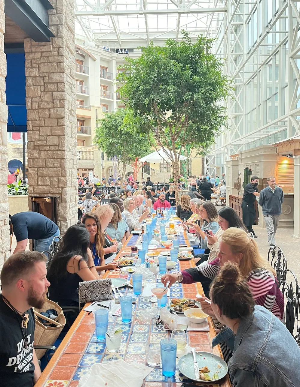 Team Legacy agents sharing a long dinner table at an event